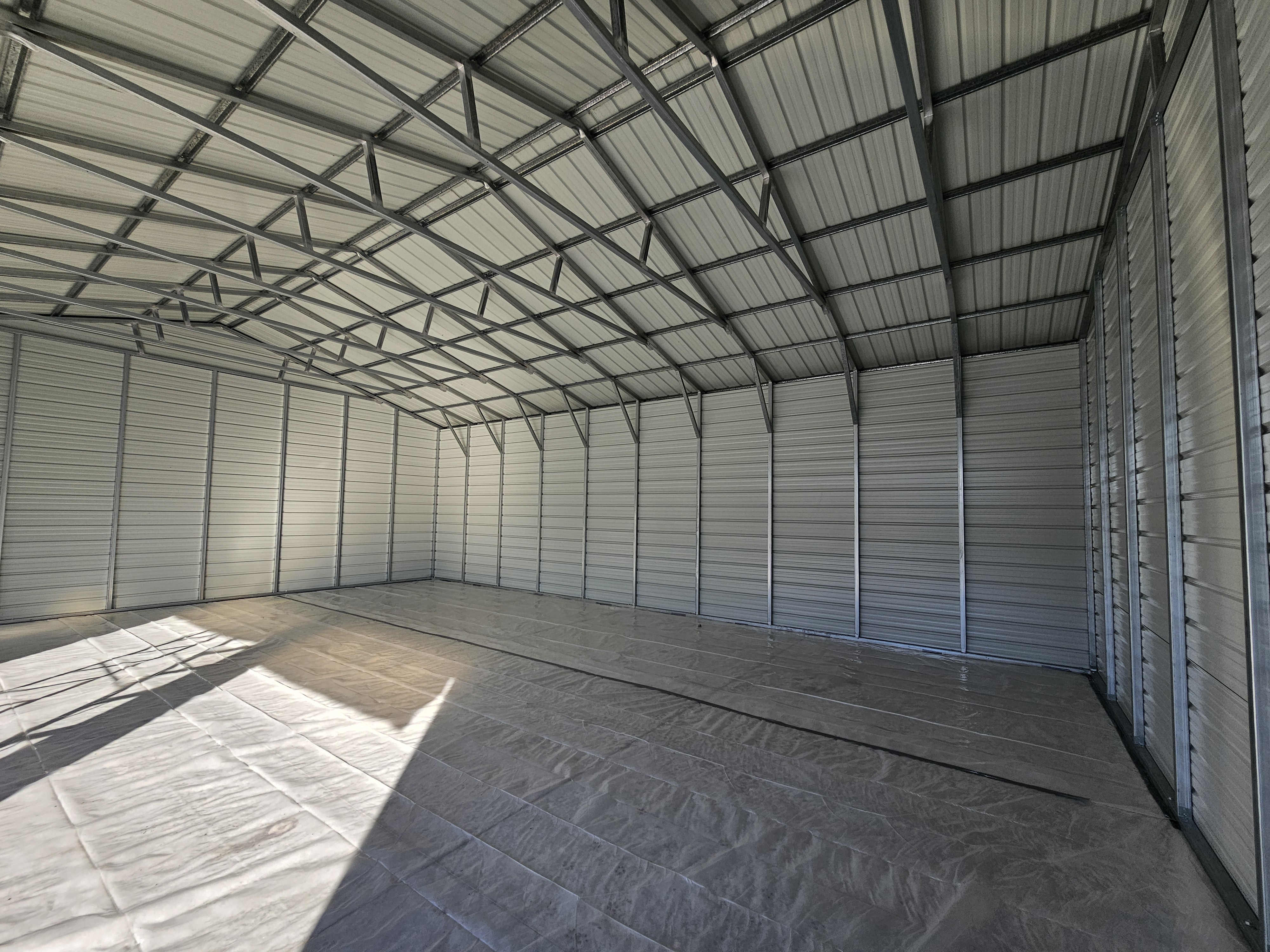 Large commercial warehouse spray foam insulation project showing industrial scale application